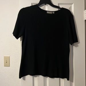 Black light weight ribbed sweater. Size 1x. No tears. 100% Acrylic.